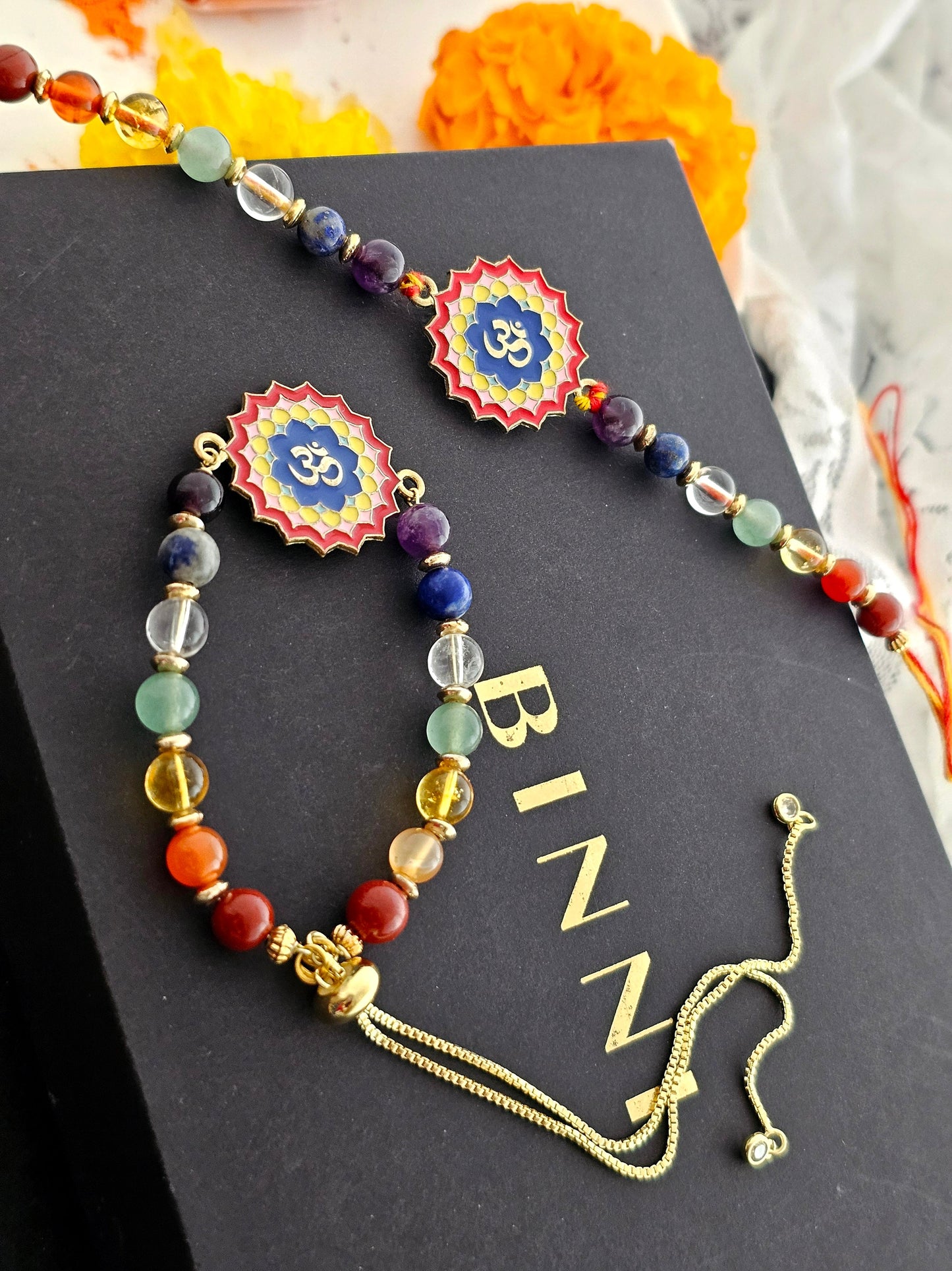 7 chakra rakhi with multi colour om