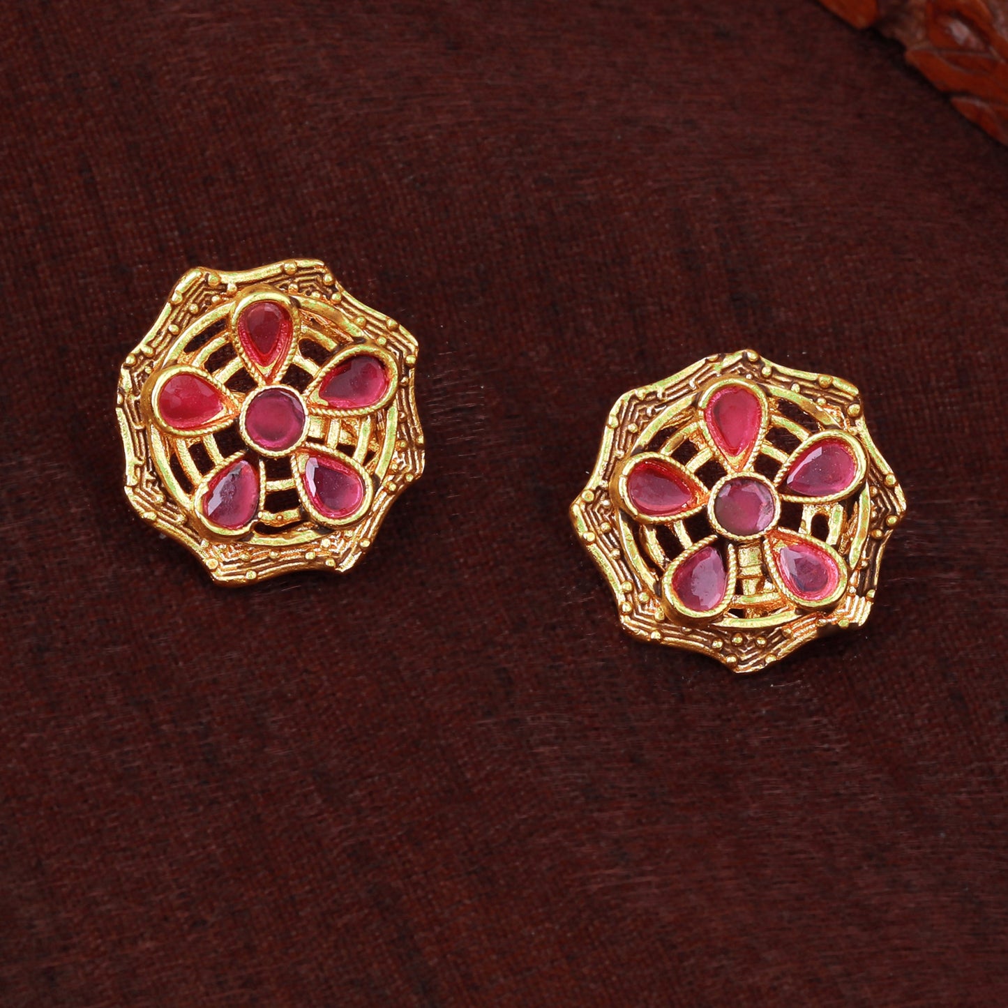 Estele Gold Plated Sparkling Flower Designer Matt Finish Stud Earrings with Ruby Crystals for Women