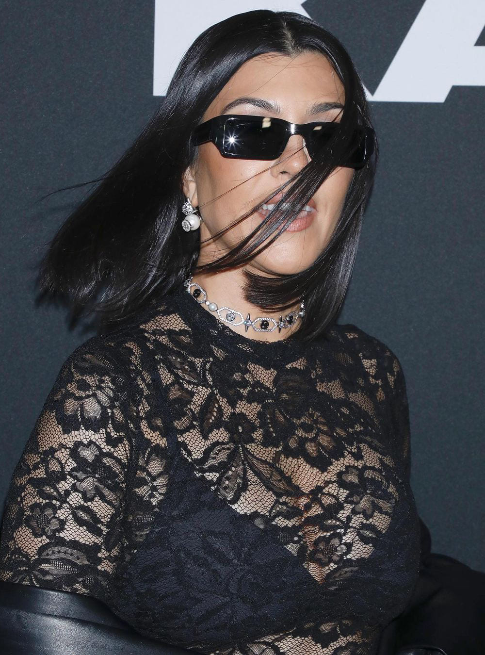 Kourtney Kardashian Wearing The Scorpia Nova Stud Earrings
