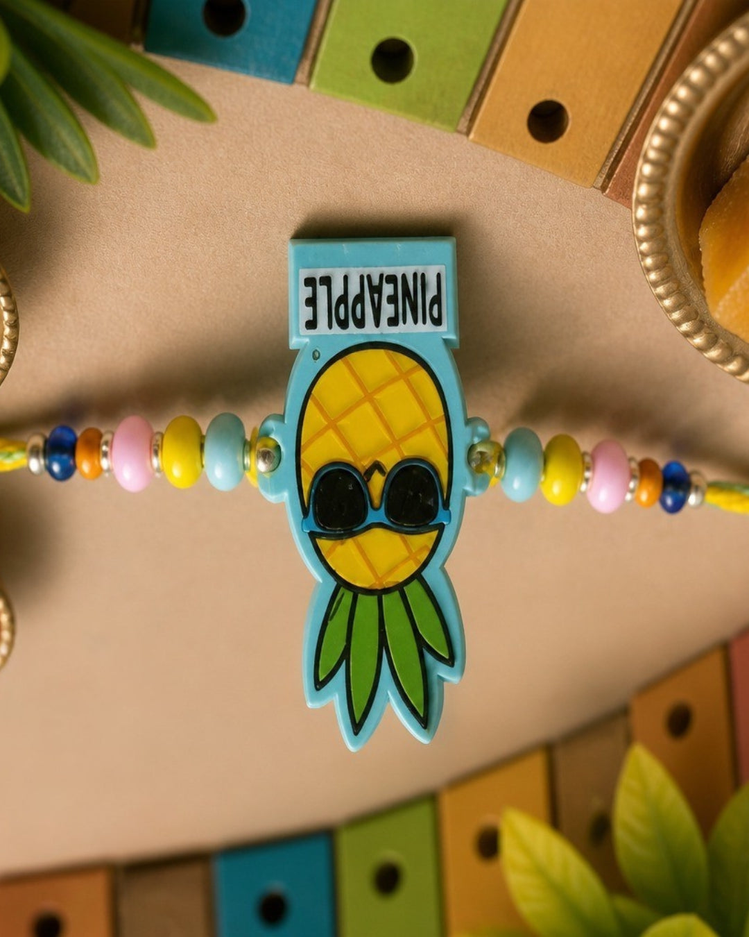 NVR Pineapple Design Kids Thread Rakhi with Roli Chawal Chandan Mishri