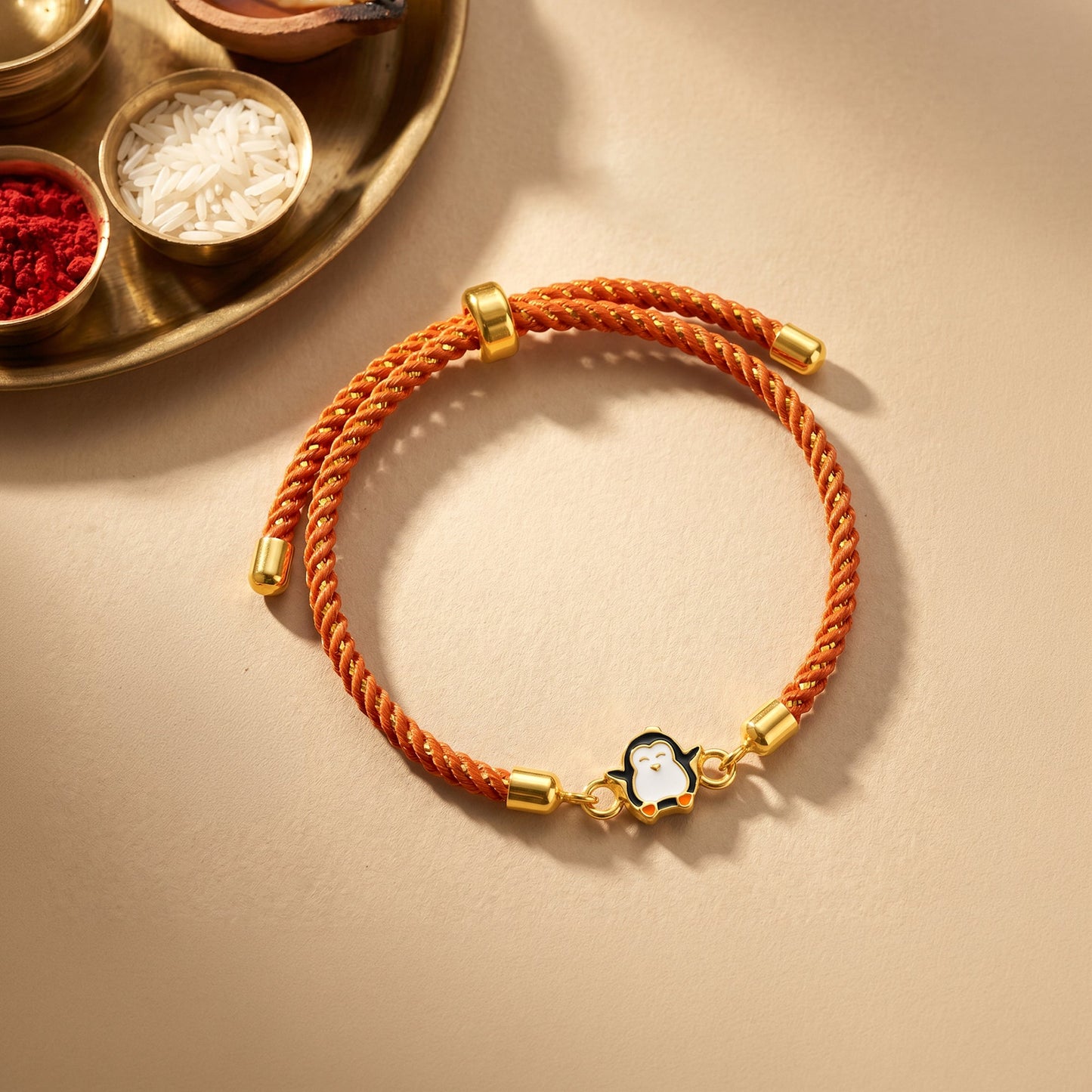 Golden Penguin Joy Rakhi