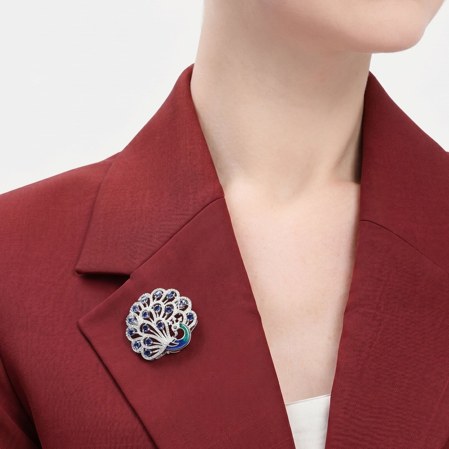 Swarnika β Morbagh CZ Blue Feather Brooch