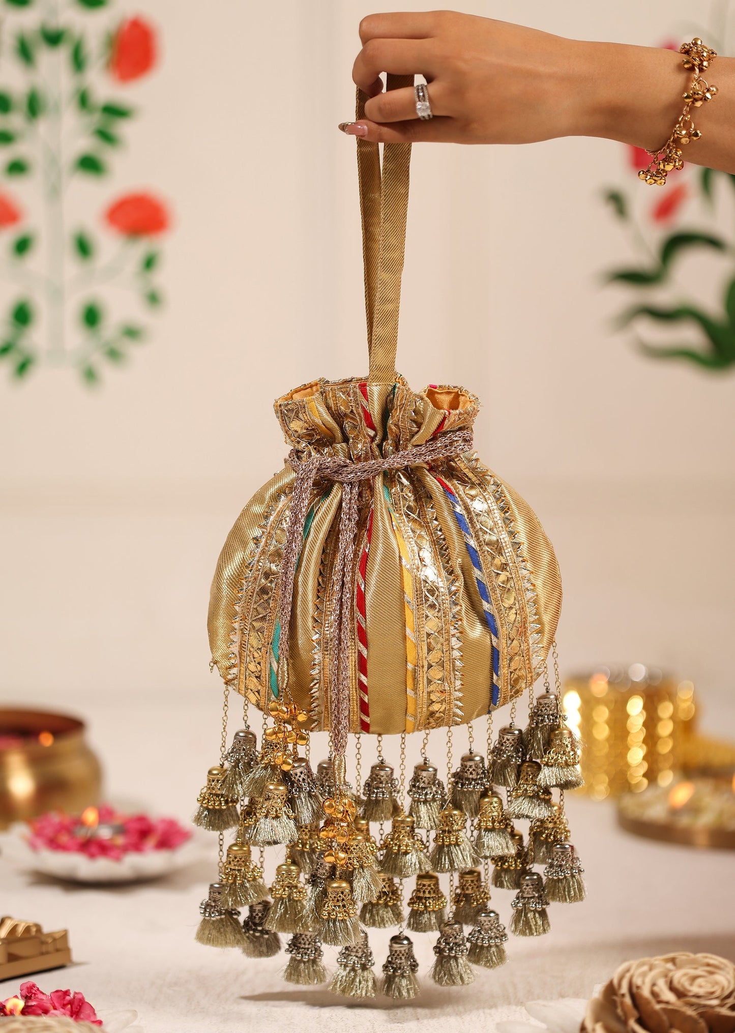 Gold Brocade Potli With Multicolour Embellishments Lace And Dangling Tassels