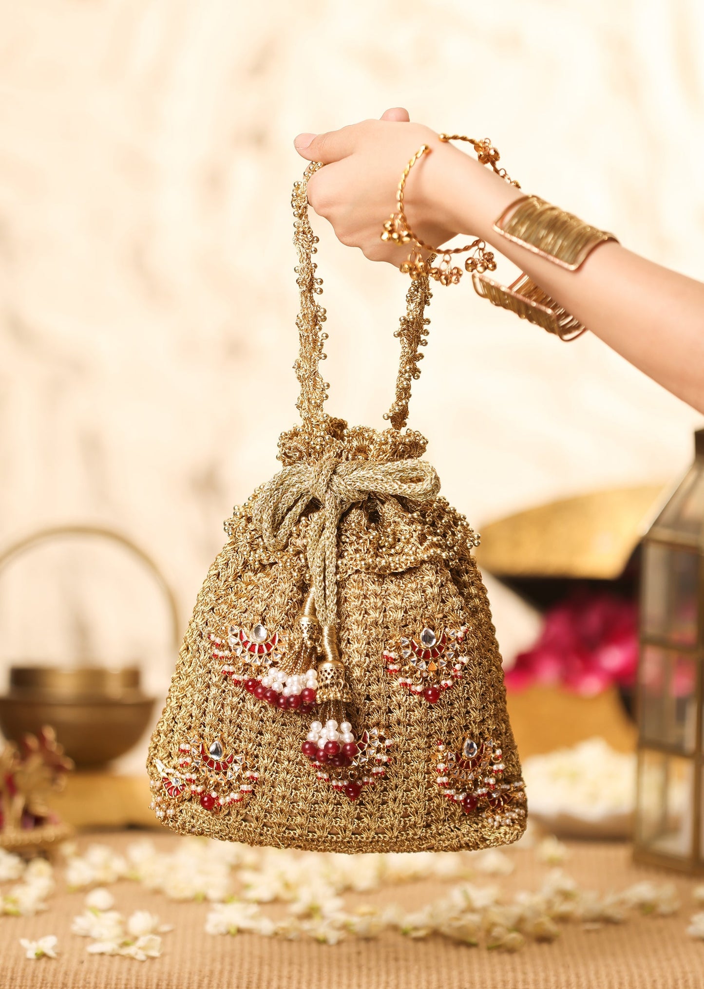 Gold Brocade Potli With Red And White Embellished Detailing