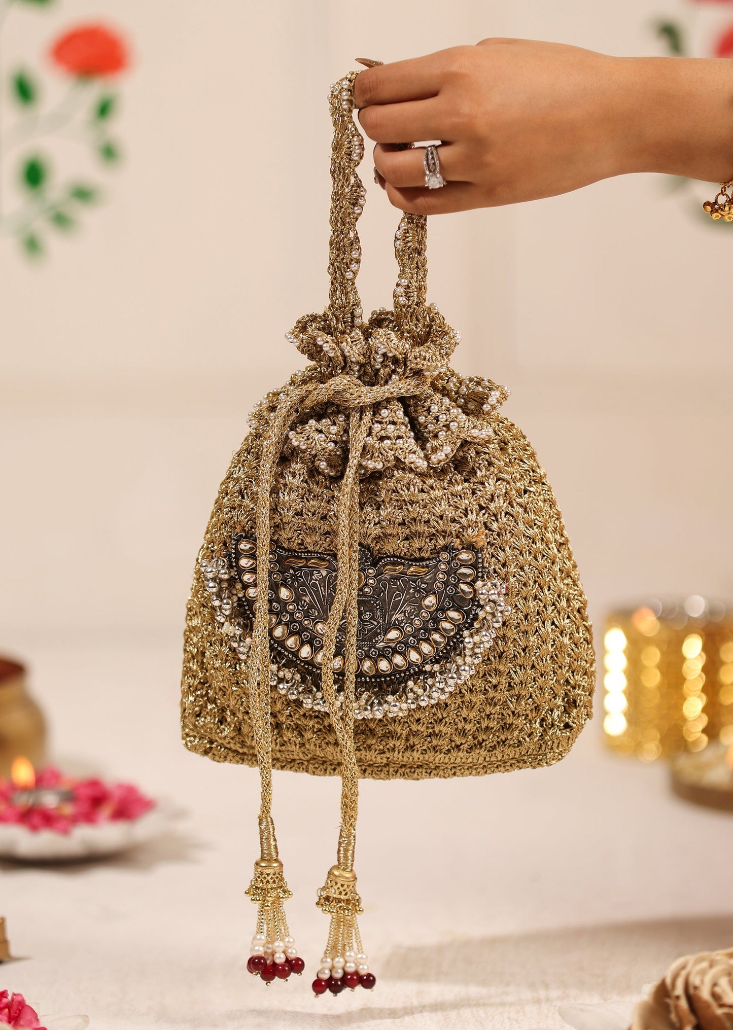 Gold Brocade Potli With Silver Embellishments