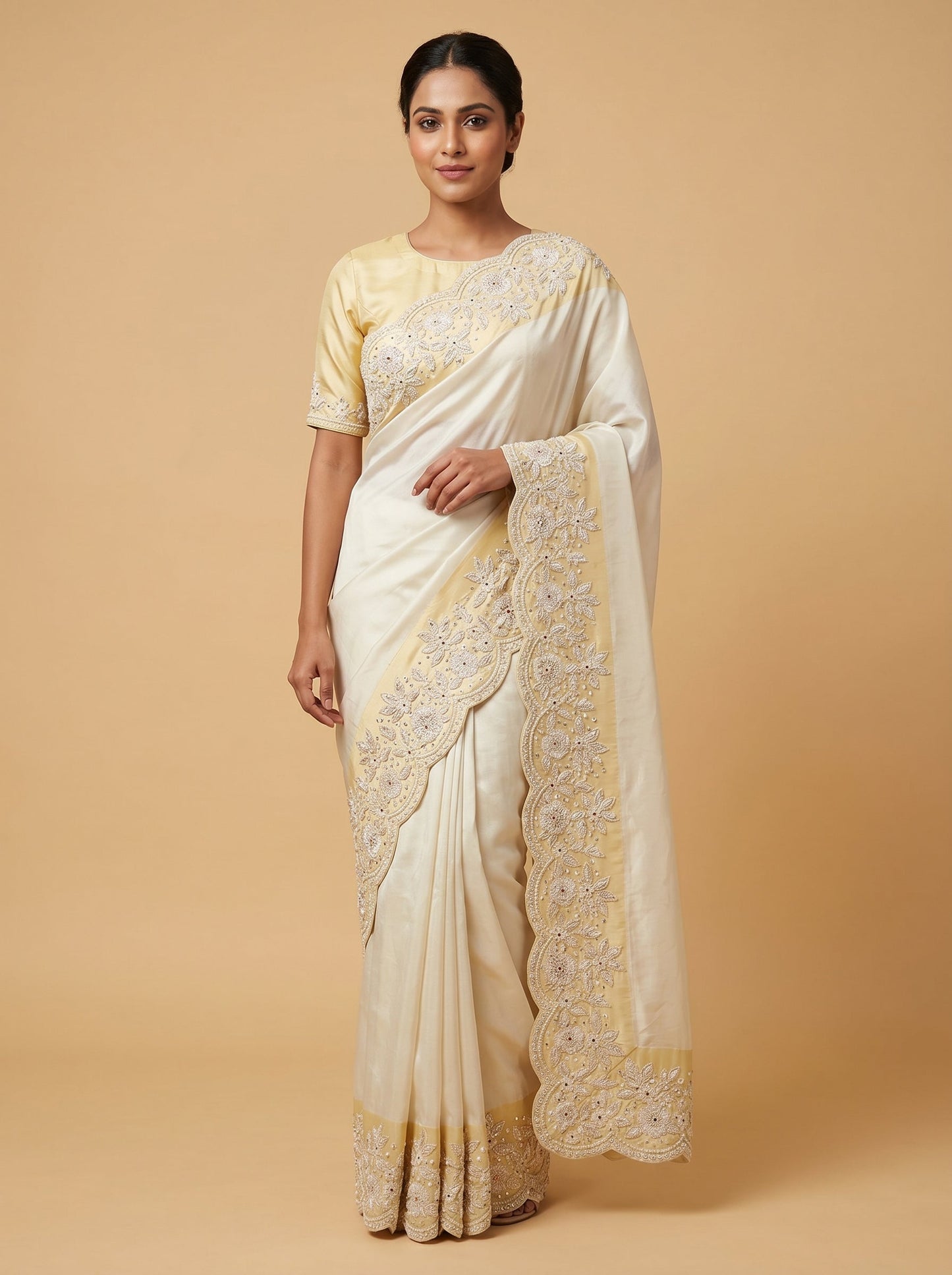 Ivory embroidered saree with elegant detailing