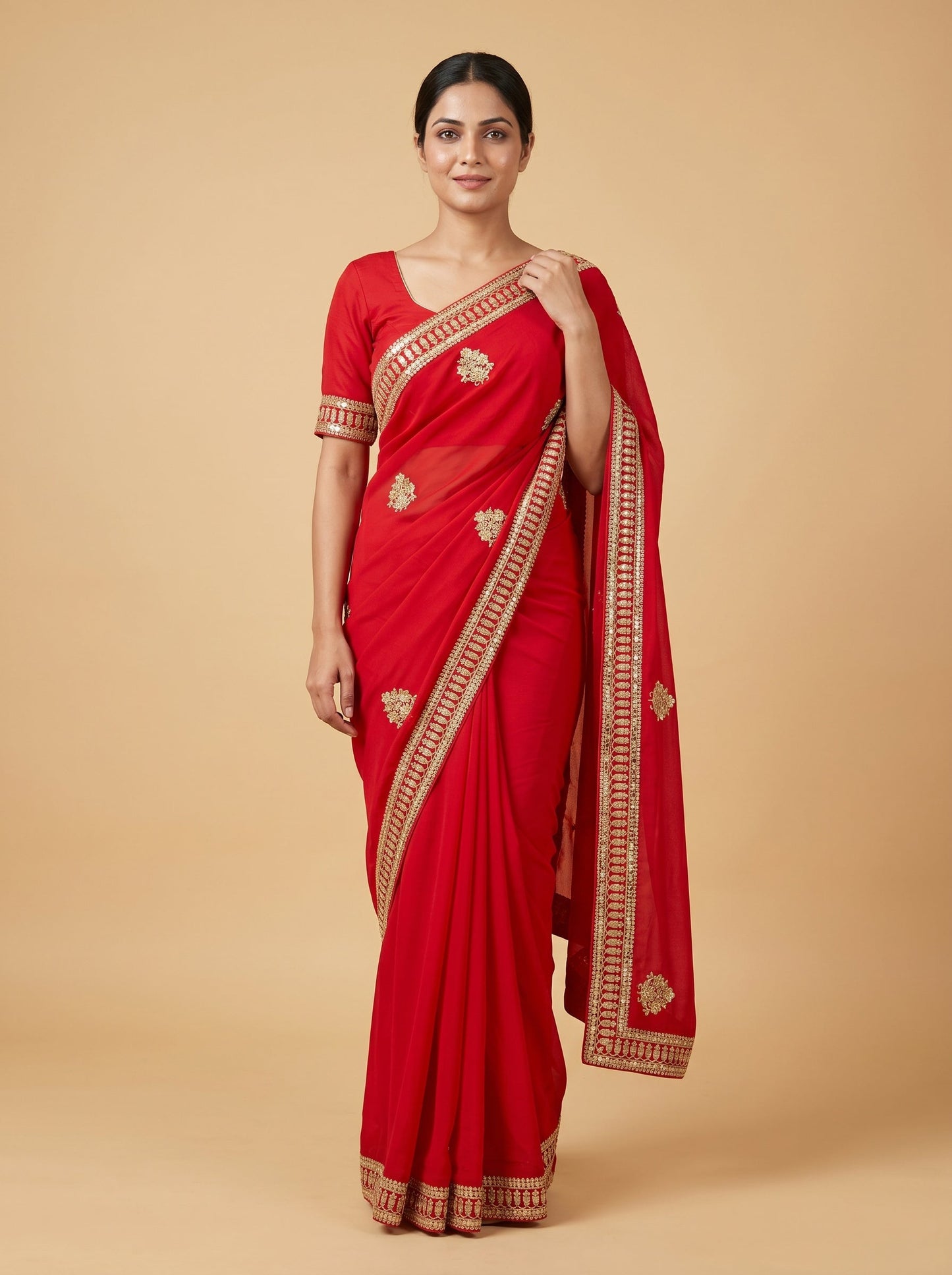 Red embroidered saree with traditional work
