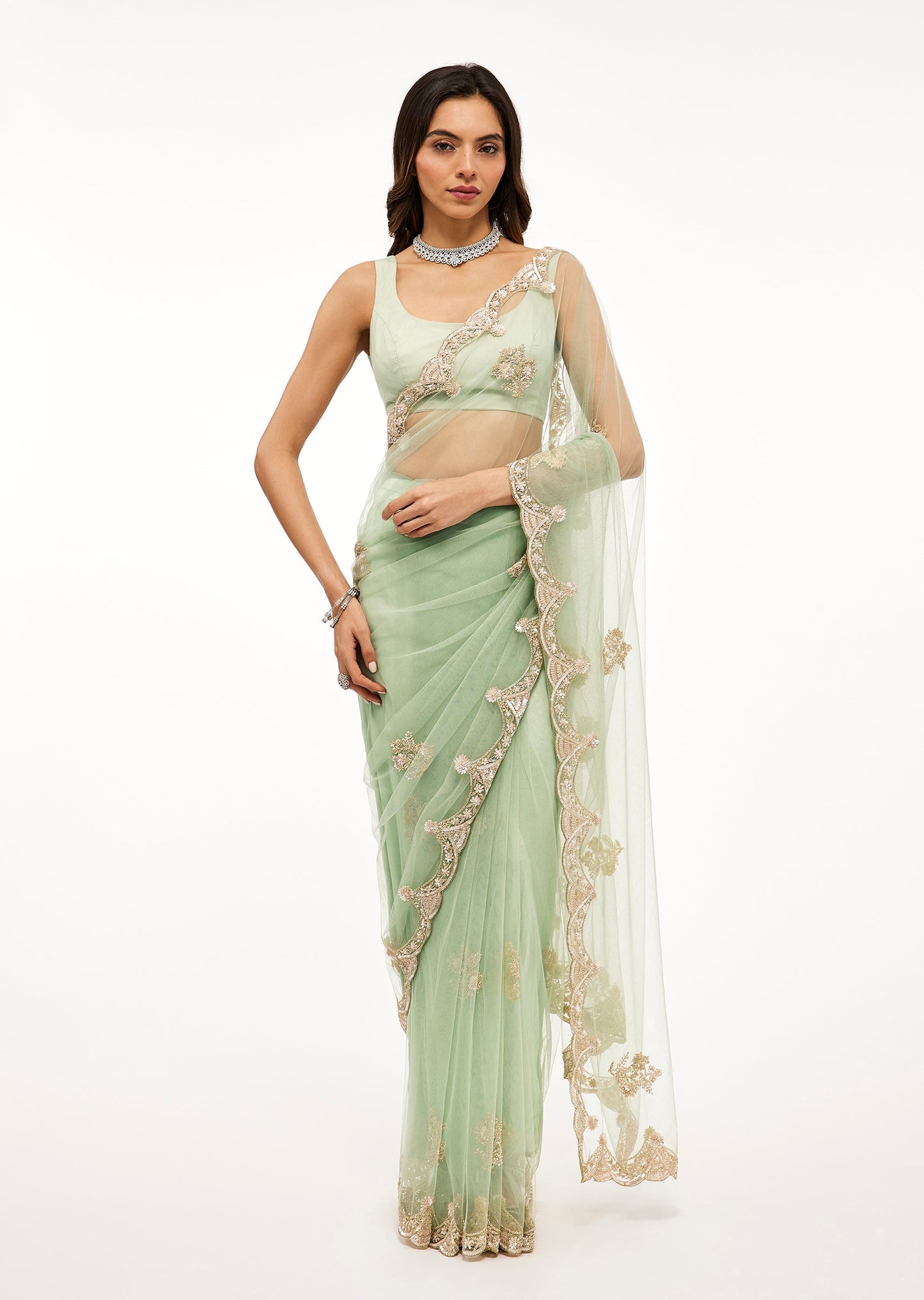 Light Sea Green Net Saree With Deep Scallop Border And Cutdana Sequin Bead Embroidery