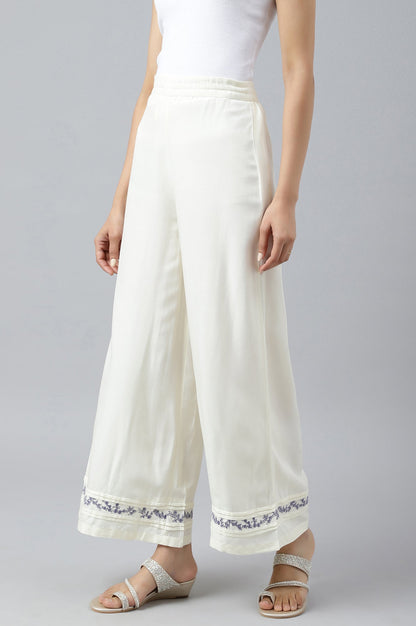W for Woman Ecru Embroidered Rayon Parallel Pants With Pleats.