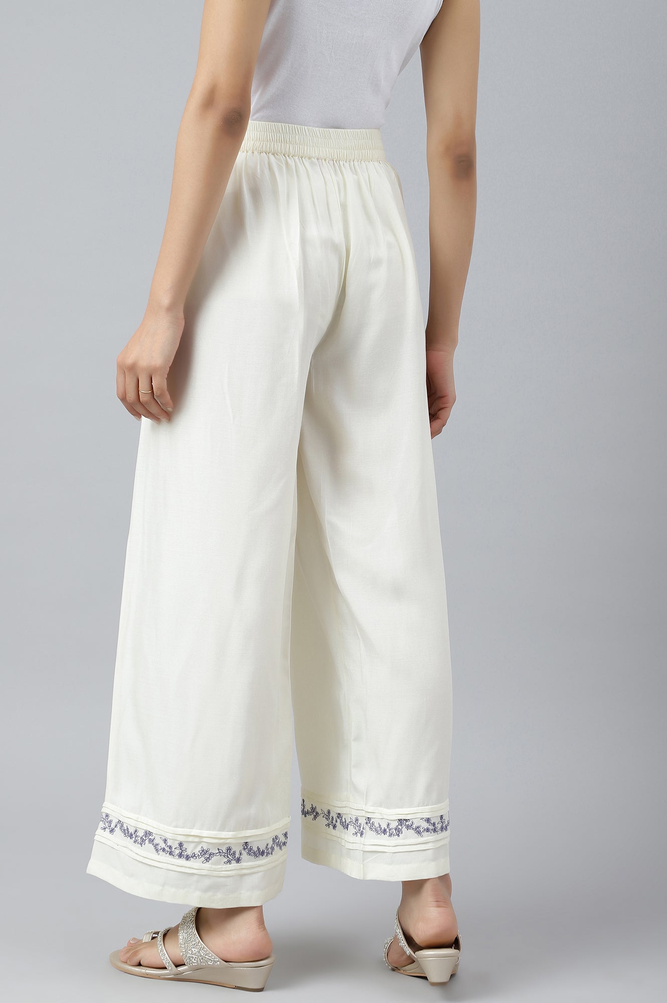 W for Woman Ecru Embroidered Rayon Parallel Pants With Pleats.