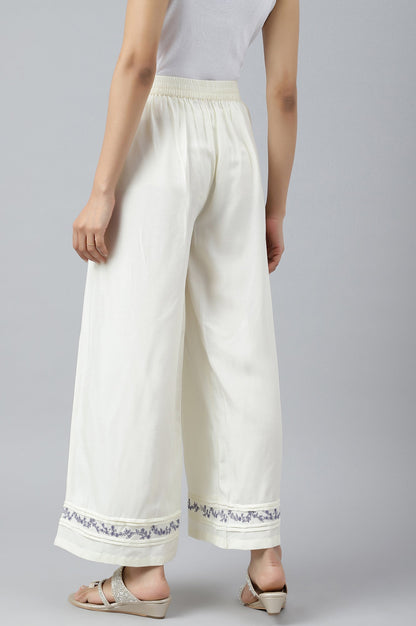 W for Woman Ecru Embroidered Rayon Parallel Pants With Pleats.