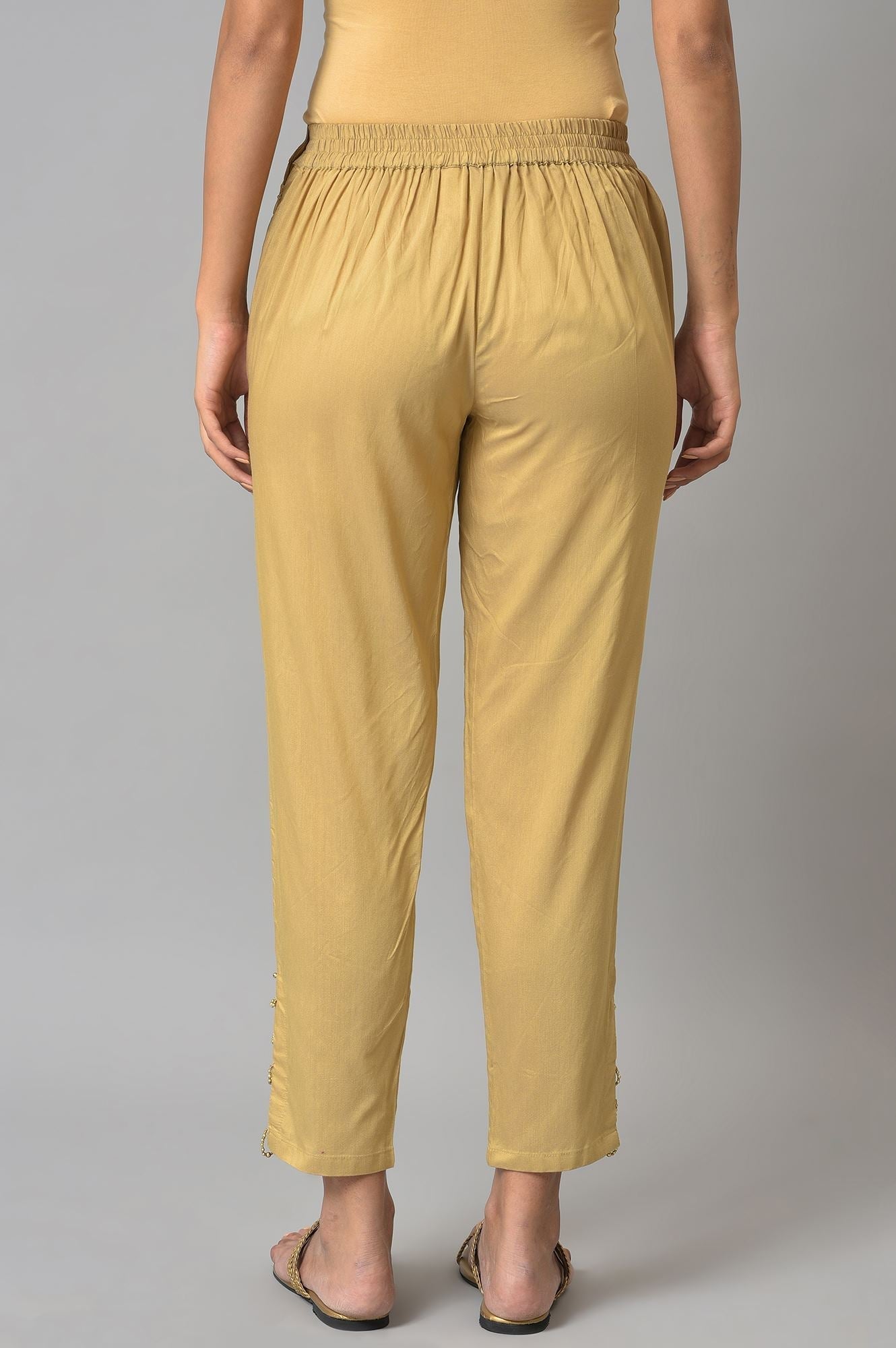 W for Woman Gold Solid Light Festive Slim Pants