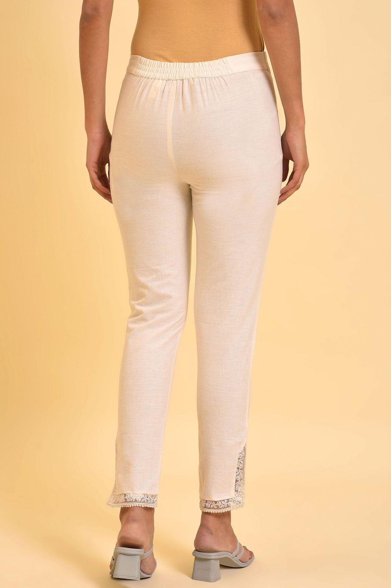 W for Woman Ecru Solid Slim Pants With Lace On Hem