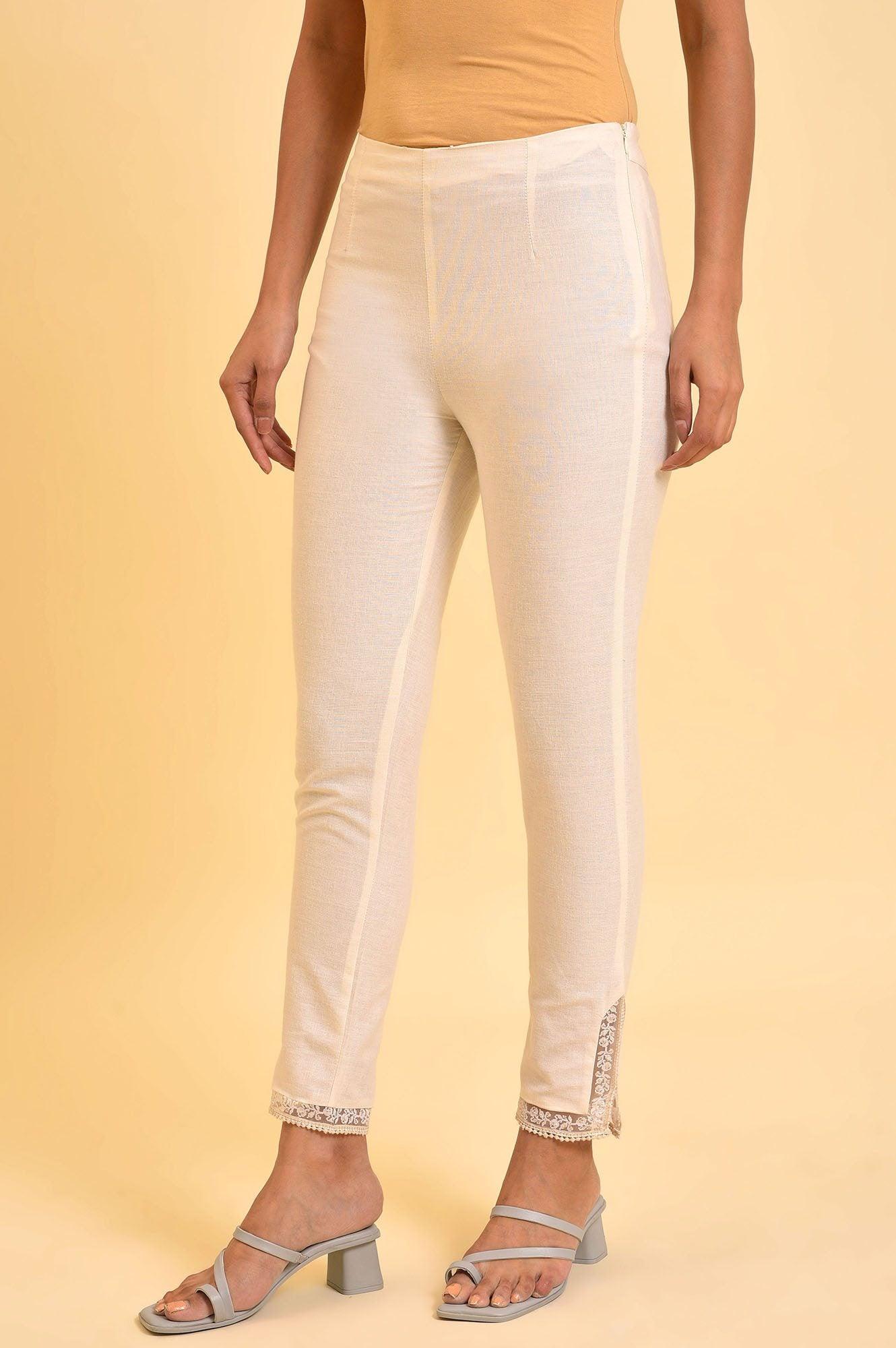 W for Woman Ecru Solid Slim Pants With Lace On Hem