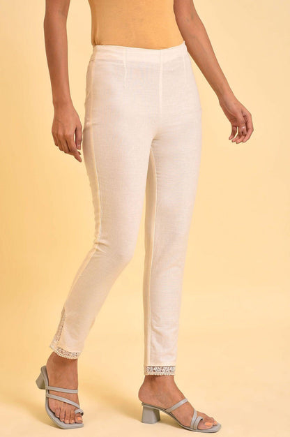 W for Woman Ecru Solid Slim Pants With Lace On Hem