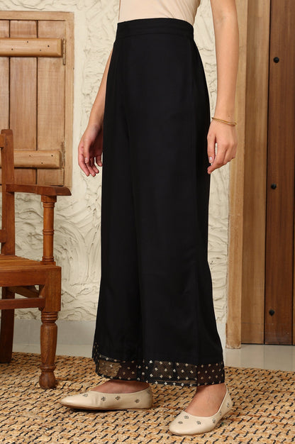 W for Woman Black Solid Rayon Parallel Pants With Embellished Organza Hemline