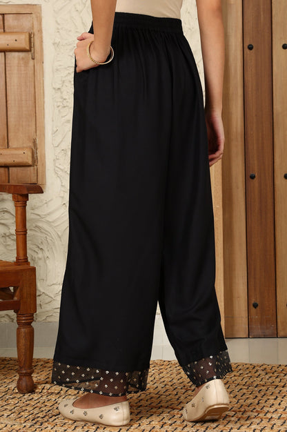 W for Woman Black Solid Rayon Parallel Pants With Embellished Organza Hemline