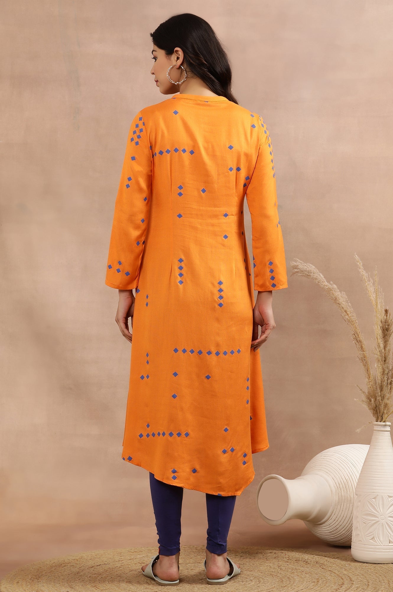 W for Woman Orange Printed Asymmetrical Kurta And Tights Set