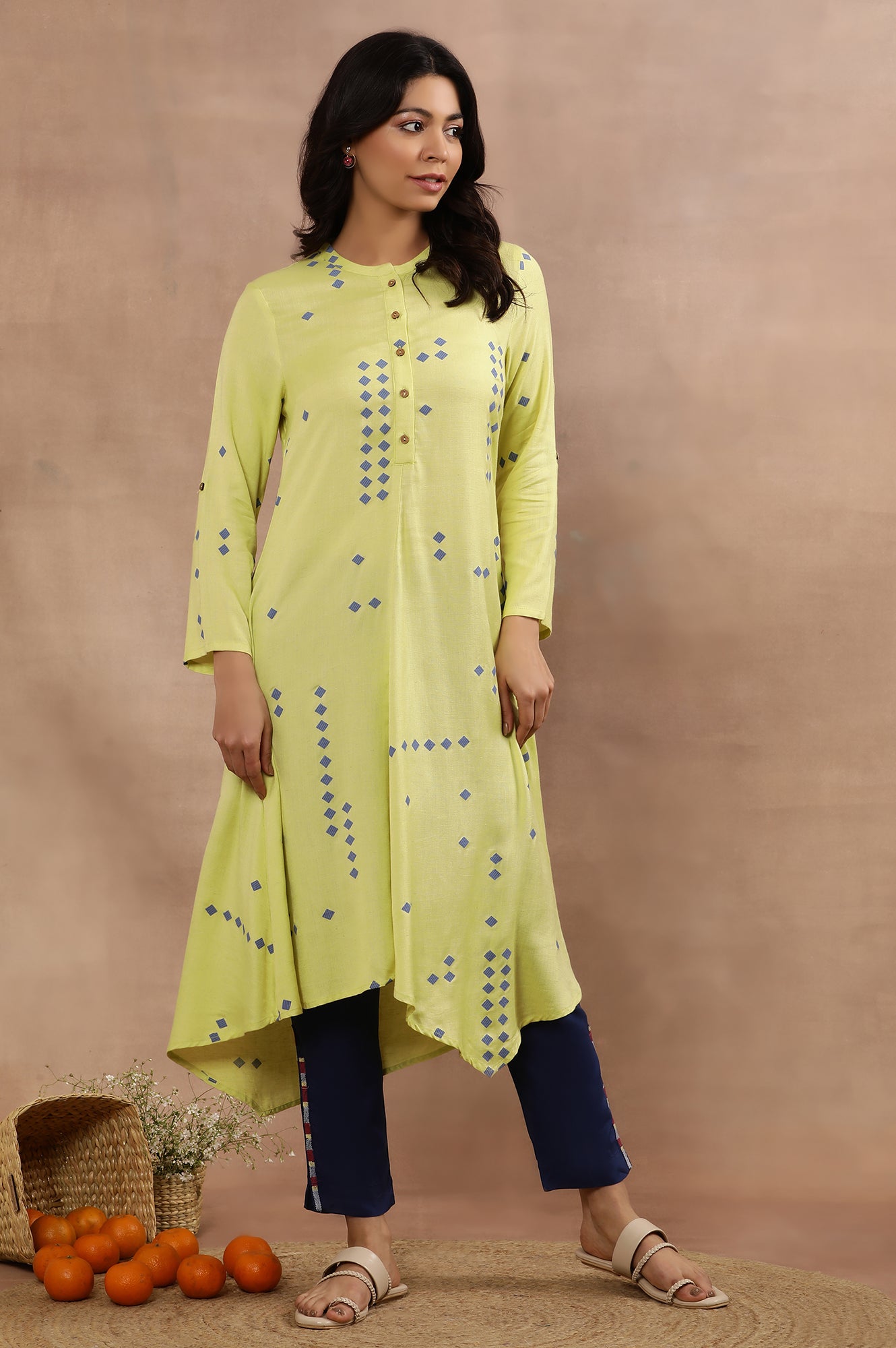 W for Woman Green Printed Asymmetrical Kurta And Blue Slim Pants Set