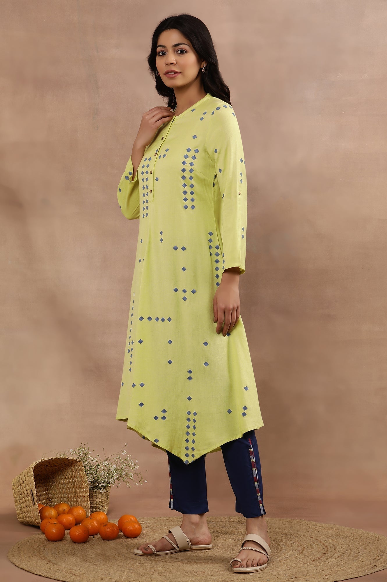 W for Woman Green Printed Asymmetrical Kurta And Blue Slim Pants Set