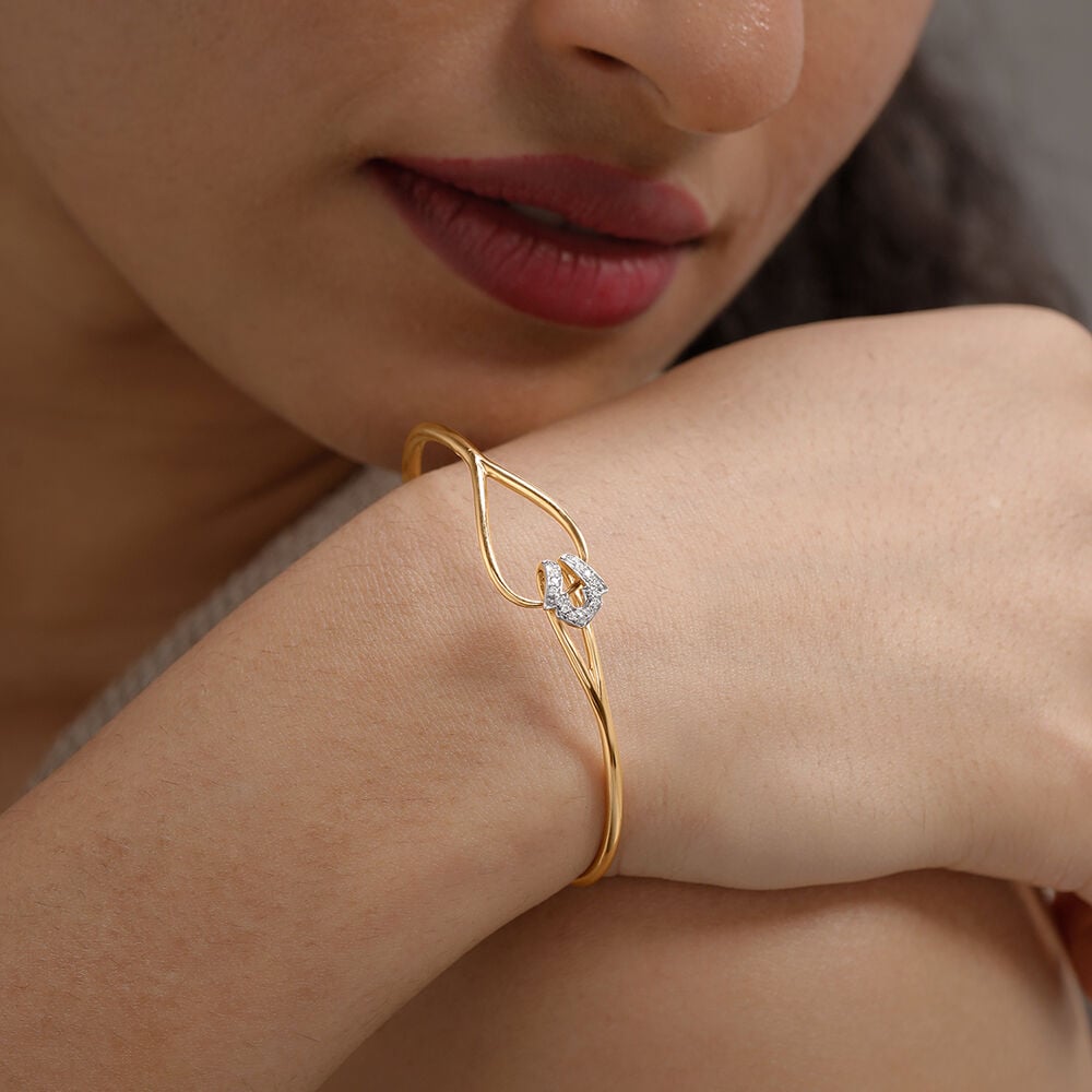 Graceful Twist Diamond Bangle in 14K Yellow Gold, 0.064 ct