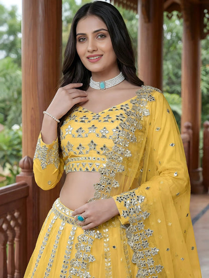 Tulsi Art Captivating Yellow Foil Work Net Sangeet Wear Lehenga Choli