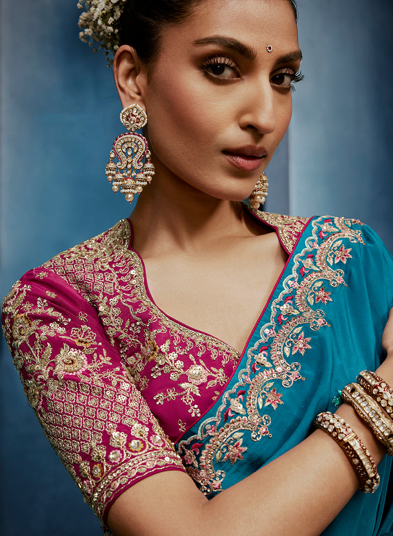 Monjolika Fashion Aqua Blue Fancy Fabric Embroidered Saree With Stitched Blouse