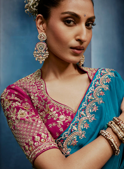 Monjolika Fashion Aqua Blue Fancy Fabric Embroidered Saree With Stitched Blouse