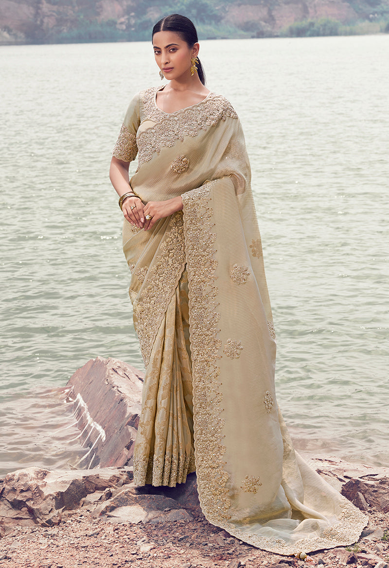 Monjolika Fashion Beige Embroidered Woven Faux Tissue Silk Saree