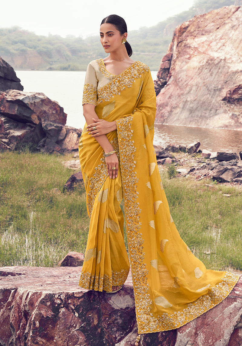 Monjolika Fashion Yellow Embroidered Woven Faux Tissue Silk Saree
