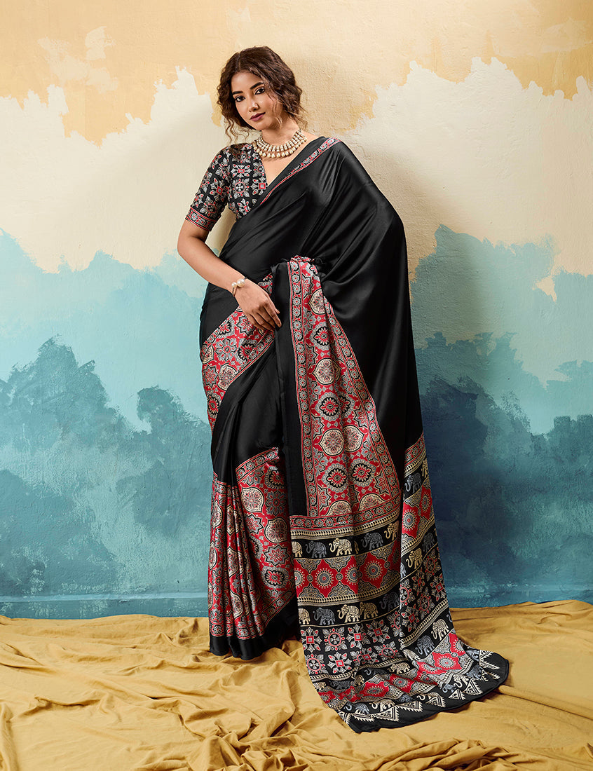 Monjolika Fashion Ajrakh Black Faux Satin Printed Saree With Ethnic Motif