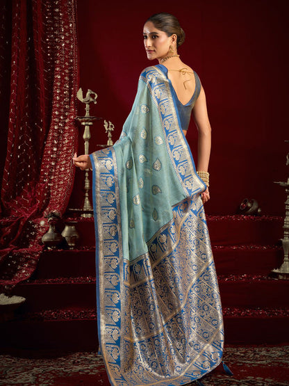 Monjolika Fashion Light Blue Soft Banarasi Silk Blend Zari Woven Saree With Blouse Piece