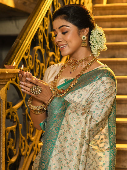 Monjolika Fashion Cream Banarasi Silk Blend Saree with Sea Green Zari Border