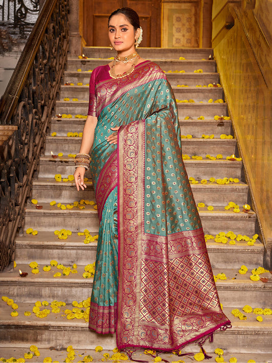 Monjolika Fashion Teal Blue Banarasi Silk Blend Saree with Magenta Zari Border