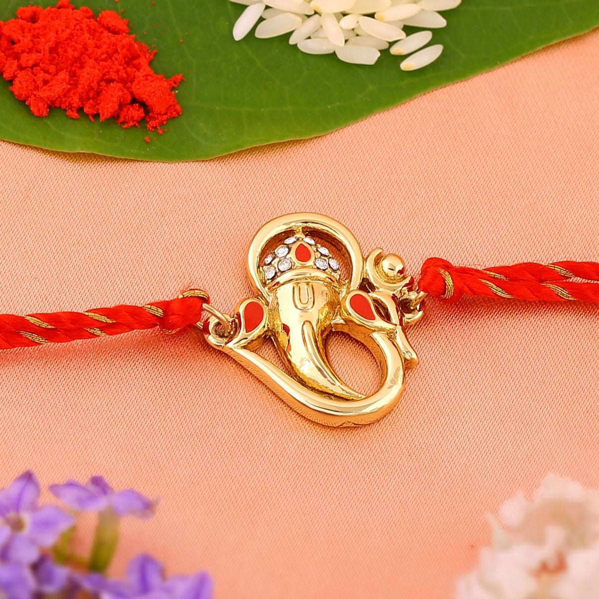 Gold Om Ganesh Crystal Rakhi