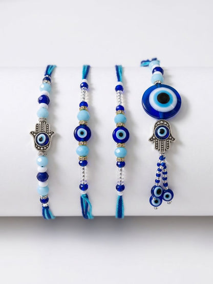 NVR Set of 4 Designer Blue Evil Eye Thread Rakhi with Roli Chawal Chandan Mishri