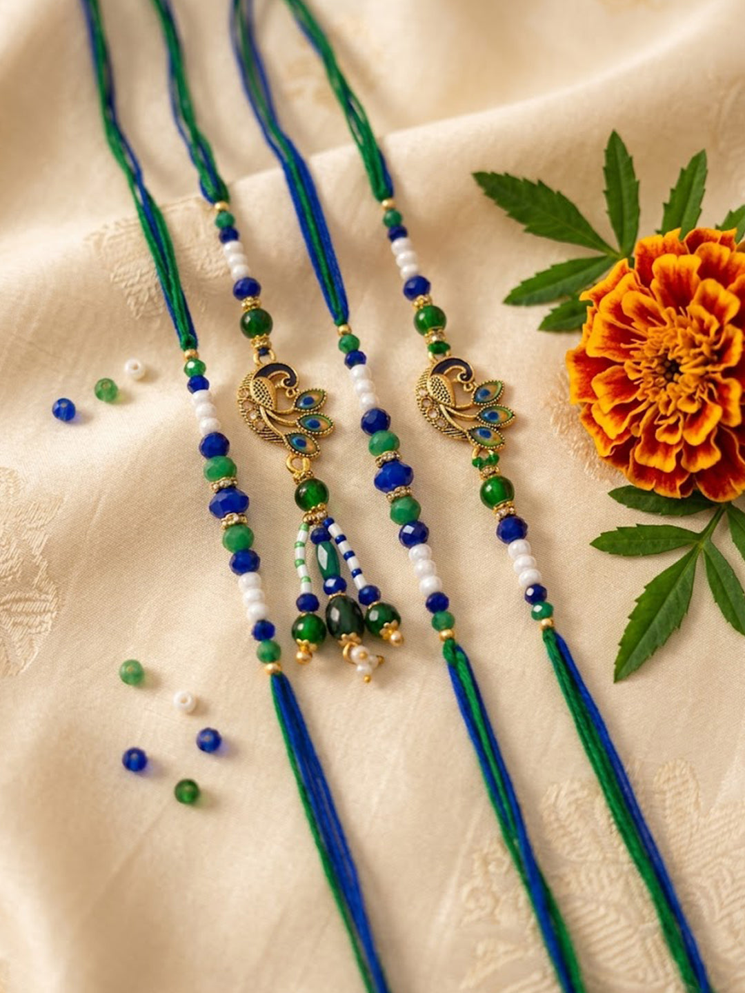 NVR Set of 4 Green Peacock Design Artificial Beads Thread Rakhi with Roli Chawal
