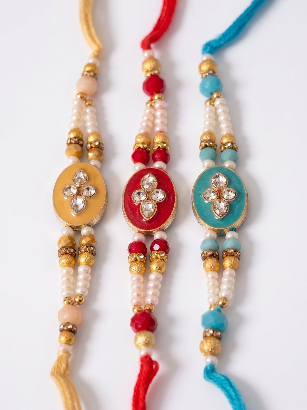 NVR Set of 3 Multicolor Artificial Beads & White Pearls Thread Rakhi with Roli Chawal