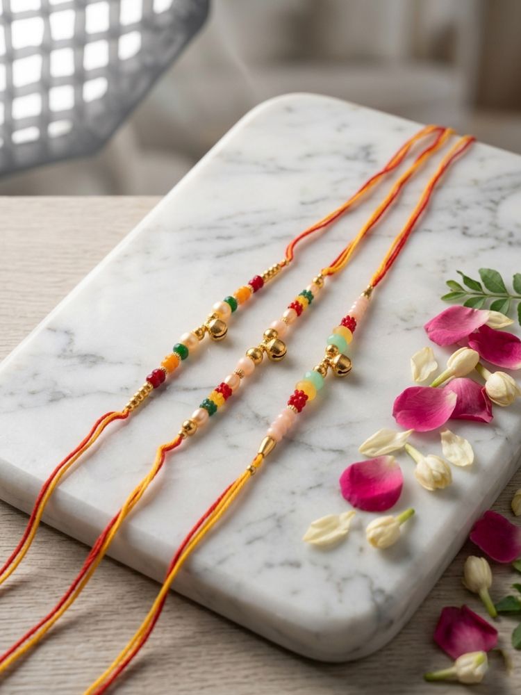 NVR Set of 3 Artificial Beads Orange Thread Rakhi With Roli Chawal Chandan Mishri