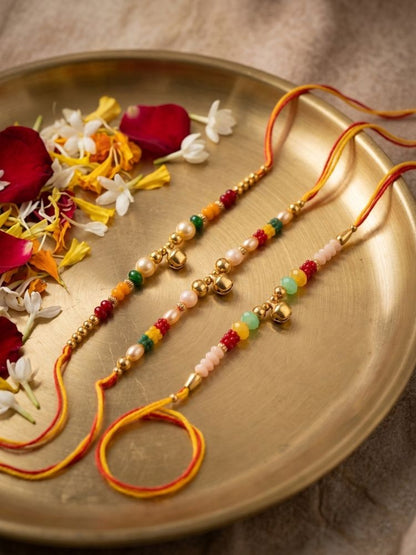 NVR Set of 3 Artificial Beads Orange Thread Rakhi With Roli Chawal Chandan Mishri