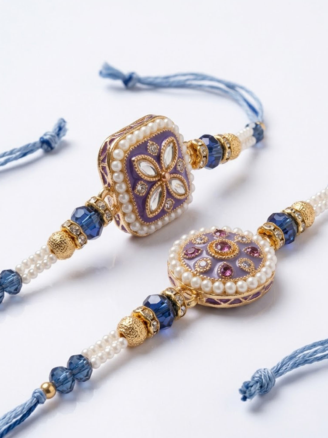 NVR Set of 2 White Pearls Thread Rakhi with Roli Chawal Chandan Mishri