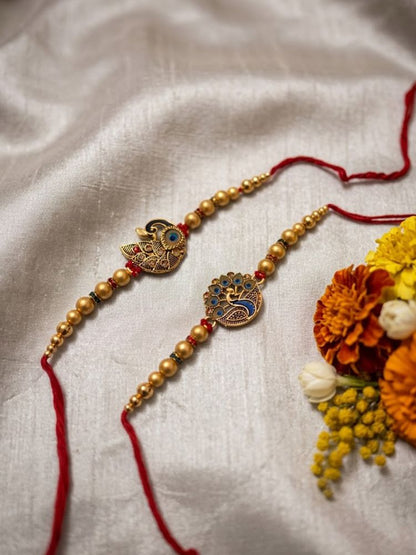 NVR Set of 2 Peacock & Ghungroo Design Multicolor Thread Rakhi with Roli Chawal Chandan