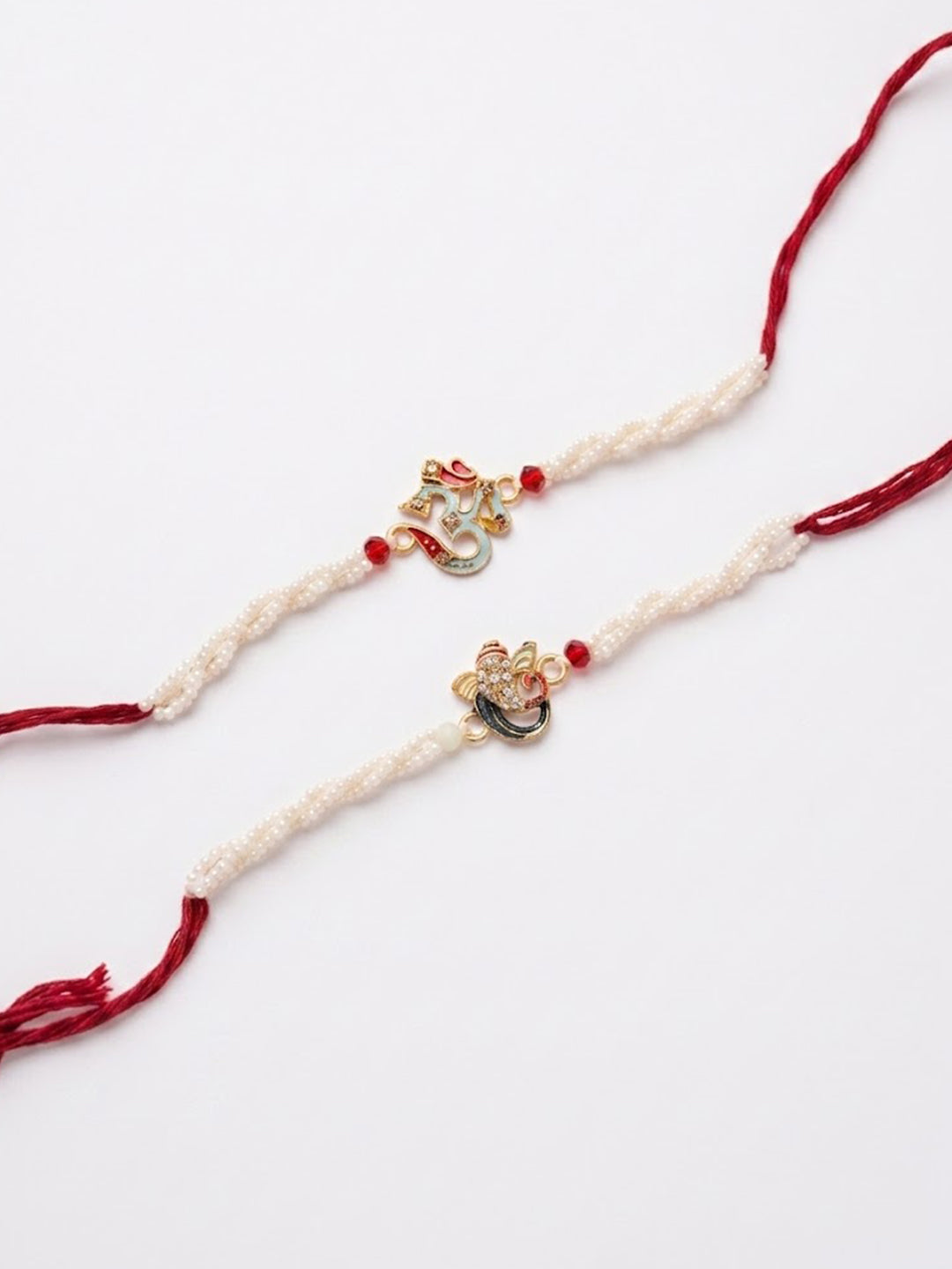NVR Set of 2 White Pearls Om & Ganesh Ji Thread Rakhi with Roli Chawal Chandan Mishri