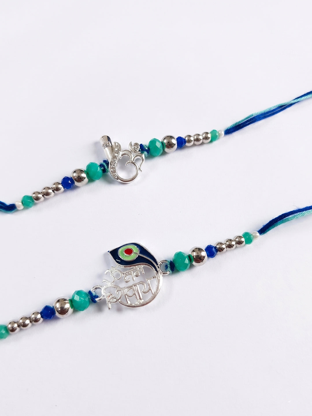 NVR Set of 2 Silver Toned Beaded Religious Thread Rakhi with Roli Chawal Chandan Mishri