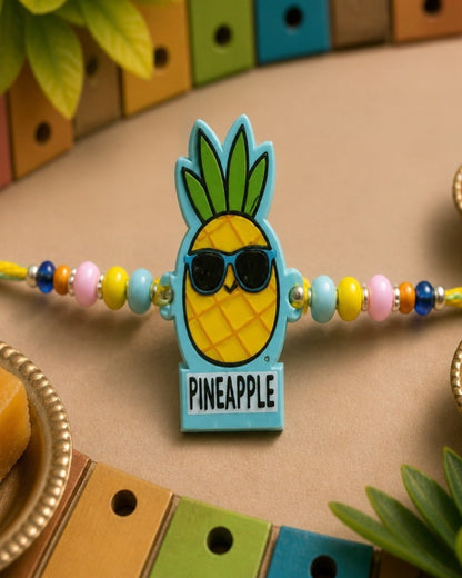 NVR Pineapple Design Kids Thread Rakhi with Roli Chawal Chandan Mishri