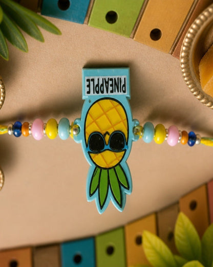 NVR Pineapple Design Kids Thread Rakhi with Roli Chawal Chandan Mishri