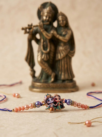 NVR Radha Krishna Multicolor Artificial Beads Thread Rakhi With Roli Chawal Chandan Mishri