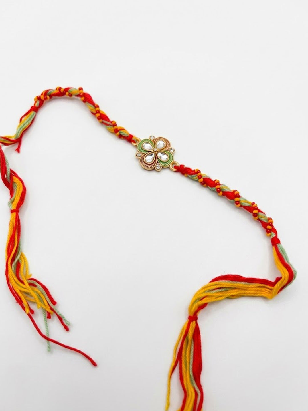 NVR Traditional Artificial Stones Thread Rakhi with Roli Chawal Chandan Mishri