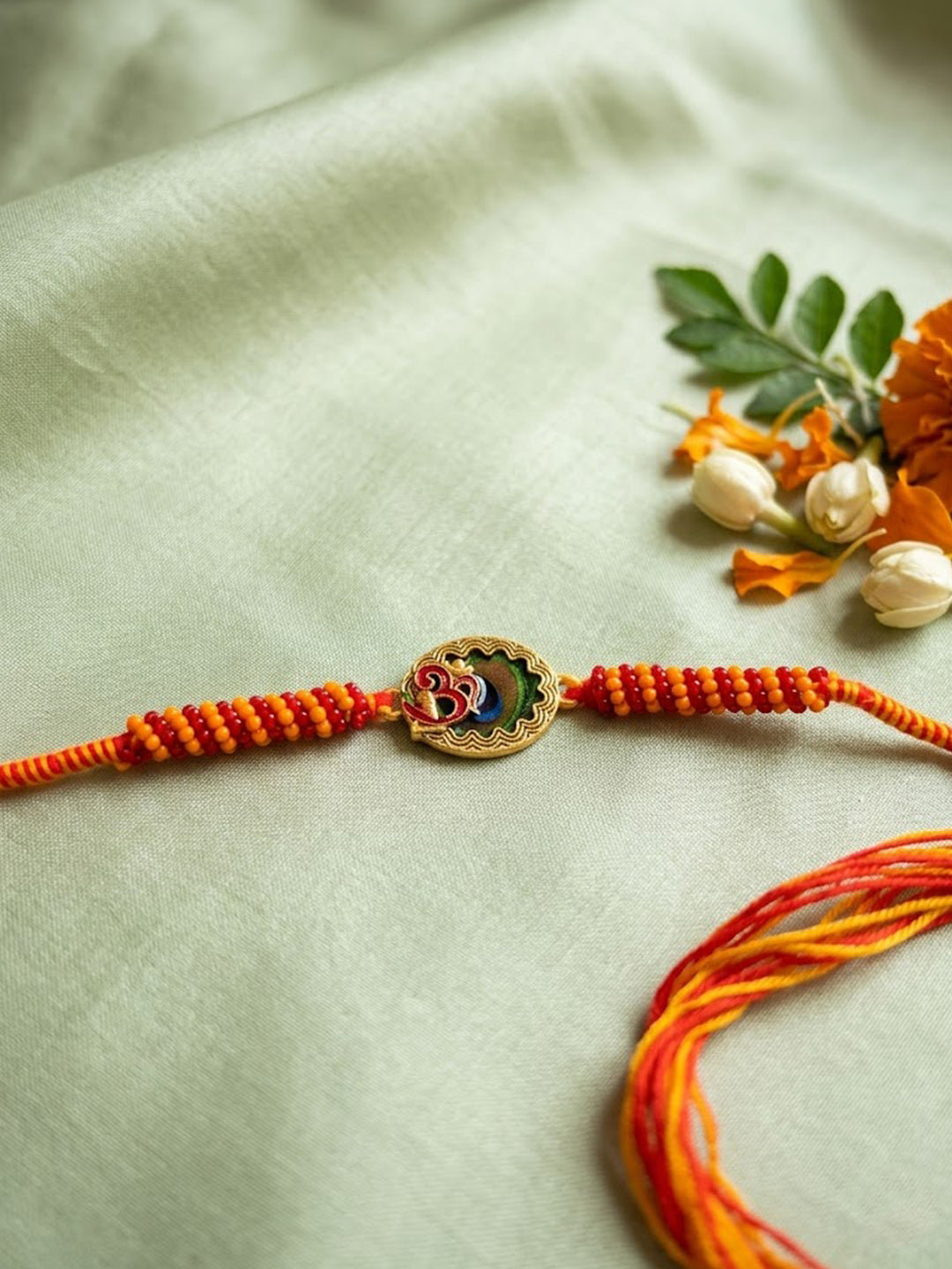 NVR Om Motif Divine Religious Thread Rakhi with Roli Chawal Chandan Mishri