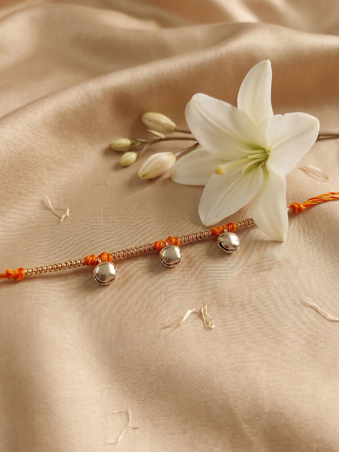 NVR Golden Ghungroo Thread Rakhi with Roli Chawal Chandan Mishri